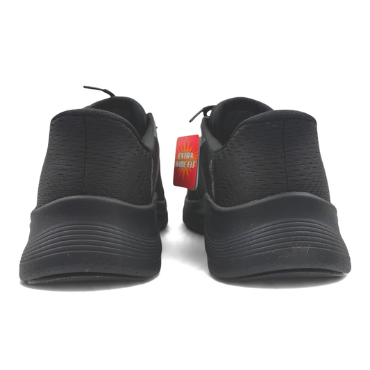 The Shoe Shop black extra wide fit athletic sneakers viewed from the back showing textured soles