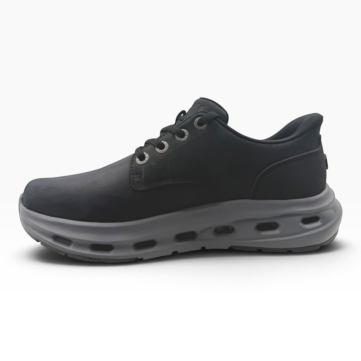 The Shoe Shop Glide Step Cade Ox sneaker in black with a thick, cushioned grey midsole and lace-up closure.