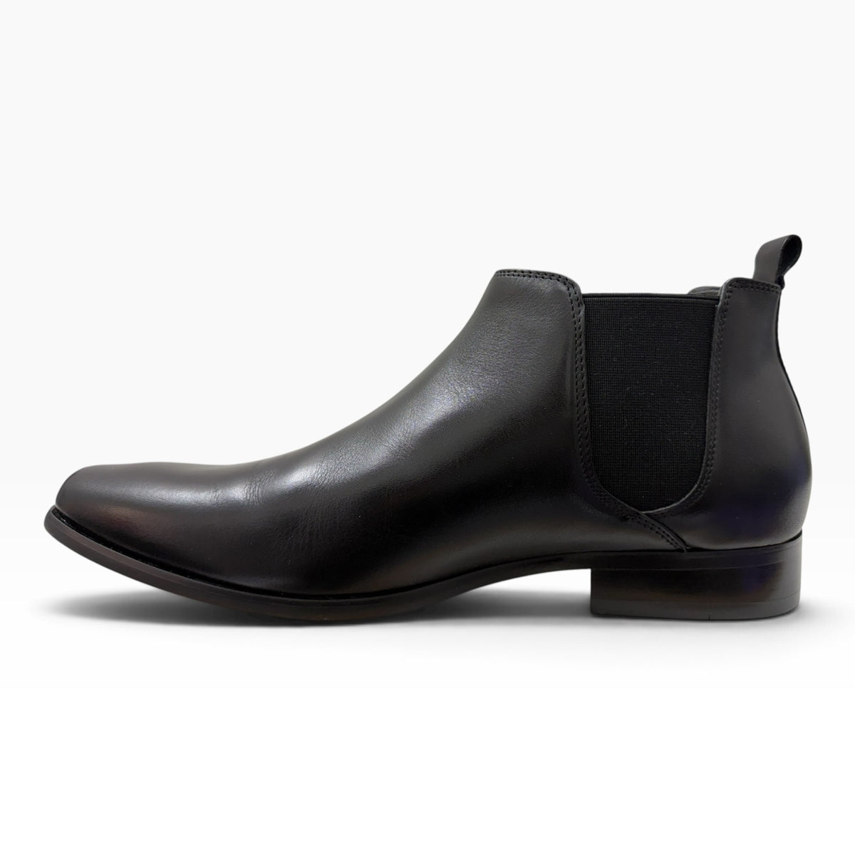 The Shoe Shop Kick Boot in black leather with an elastic side gusset, heel pull tab, and durable rubber outsole.