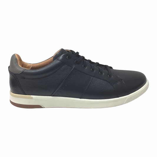The Shoe Shop Crossover Lace Sneaker in black leather with a white rubber sole and brown heel accent