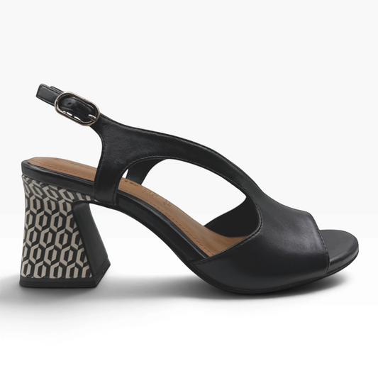 The Shoe Shop black leather heeled sandal with an open toe, adjustable slingback, and geometric patterned block heel.