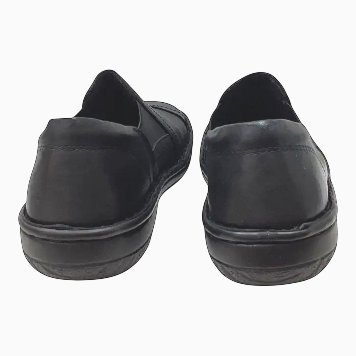 The Shoe Shop Cabello black leather slip-on shoes featuring a padded heel collar and flexible sole, rear view.