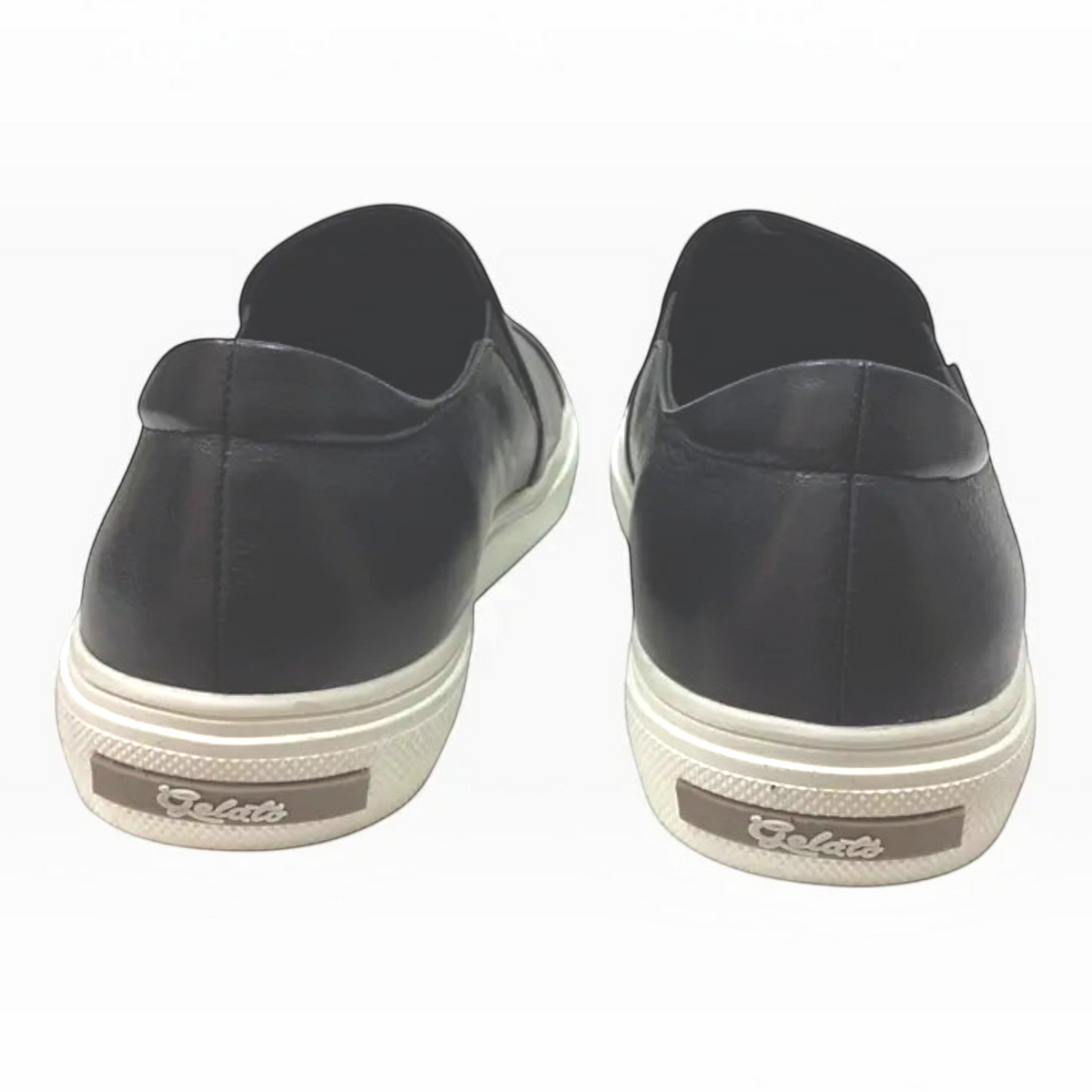 The Shoe Shop Icecap black leather sneakers with a low-profile design and white rubber soles, rear view.