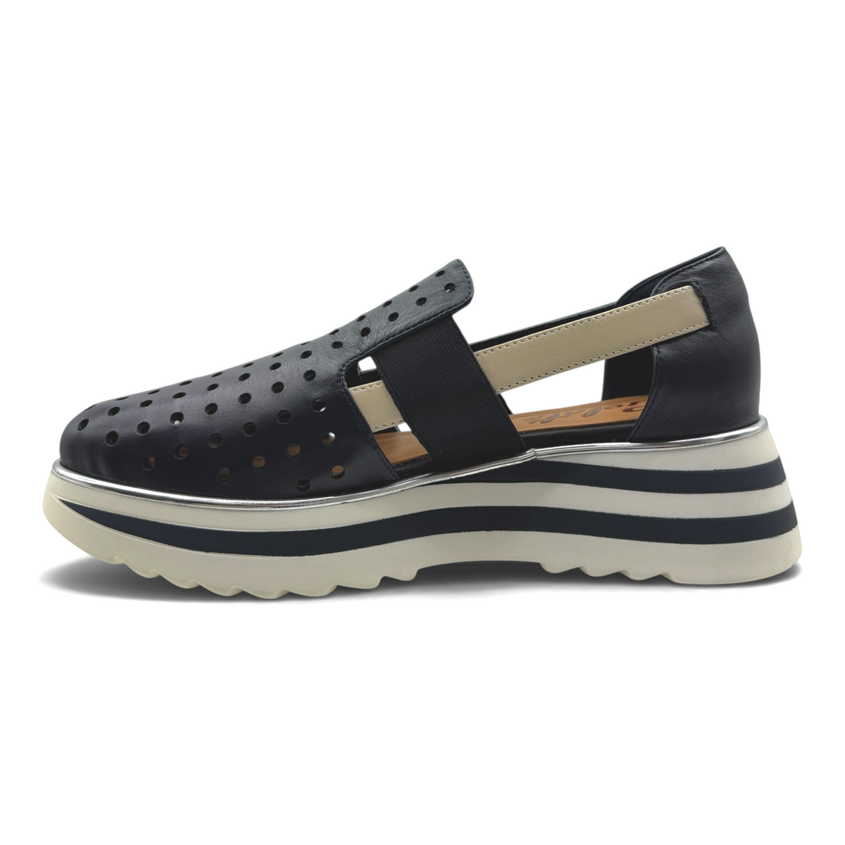 The Shoe Shop black perforated slip-on flat with an elasticated strap and a striped lightweight platform sole.