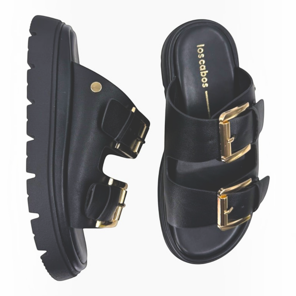 The Shoe Shop Los Cabos Toledo black slide sandals with twin gold buckle straps and a chunky platform lug sole.