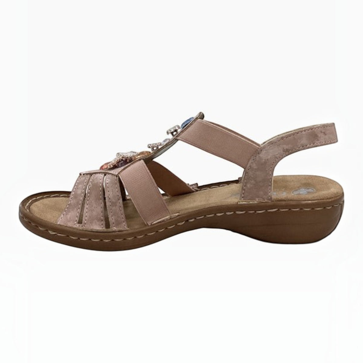 The Shoe Shop Rieker blush pink suede leather sandal with elastic straps, gem embellishments, and a low wedge sole.