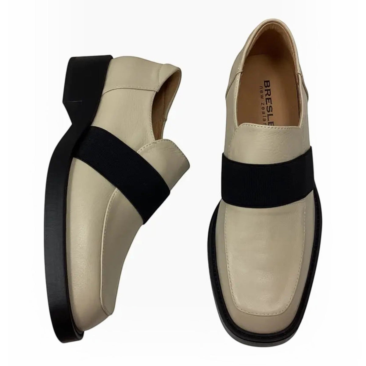 The Shoe Shop Bresley Penmark cream leather slip-on loafers with a black elastic band and 3.5cm block heel.