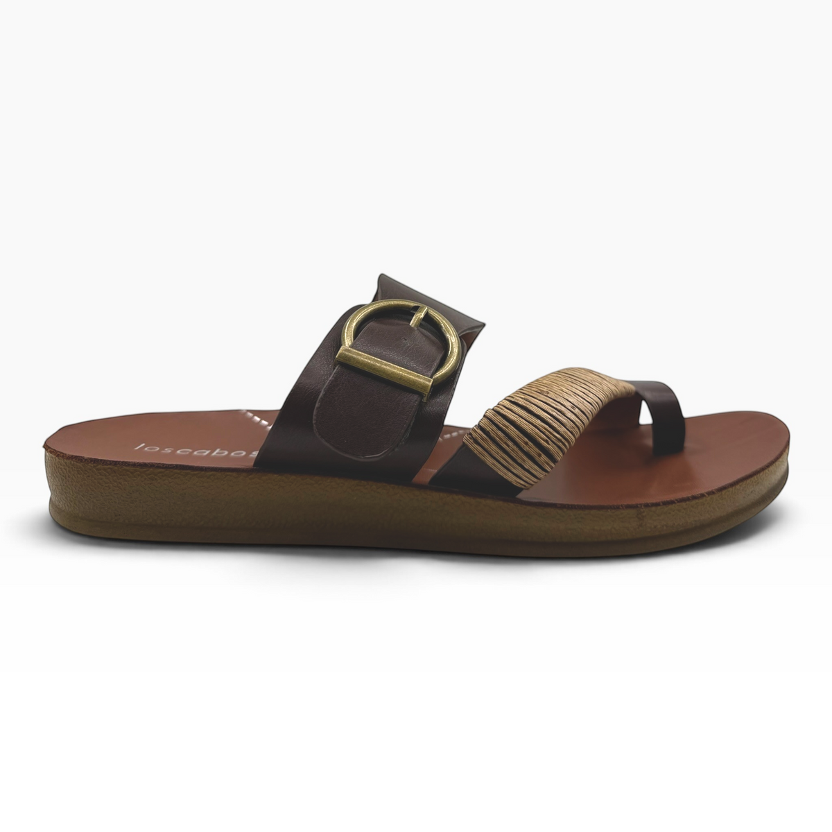 The Shoe Shop Bria sandal featuring a brown strap with antique buckle and natural bamboo-wrapped toe detail.