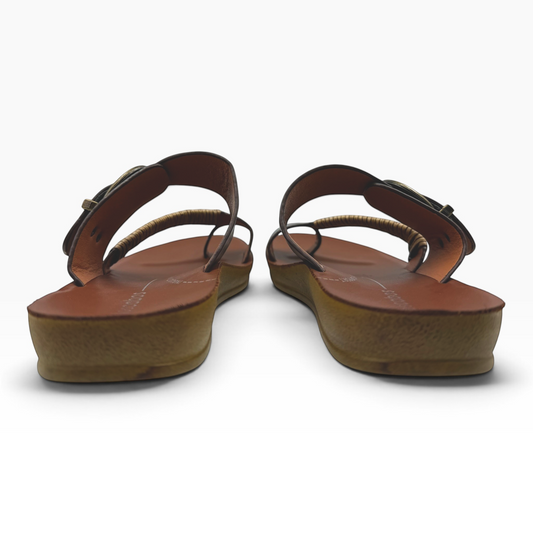 The Shoe Shop Bria sandal featuring a tan leather footbed, bamboo-wrapped toe strap, and antique-style ankle buckle.
