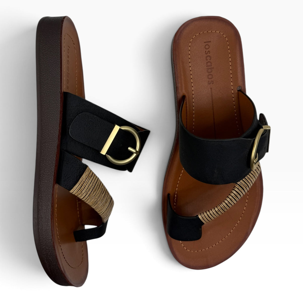 The Shoe Shop Bria Wide black sandals with a brown footbed, gold buckle detail, and woven strap accent.