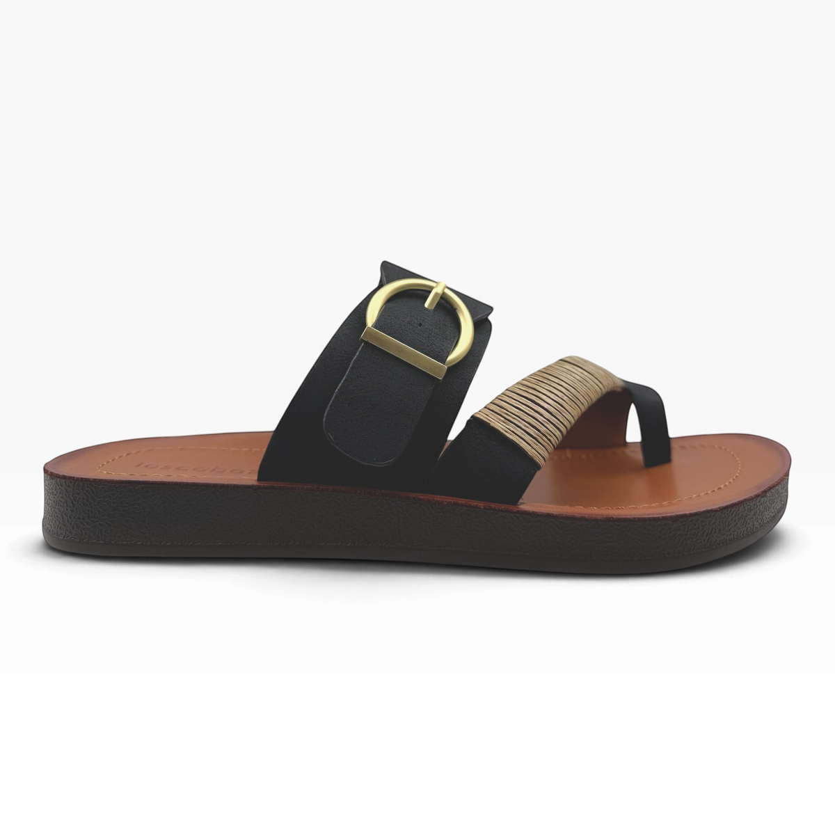 The Shoe Shop Bria Wide black slide sandals with a gold buckle and woven strap detail on a brown footbed.