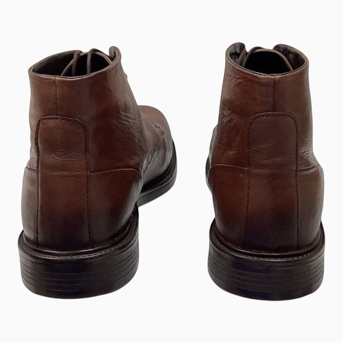 The Shoe Shop Quota brown leather ankle boots shown from the back, featuring a polished finish and durable sole.