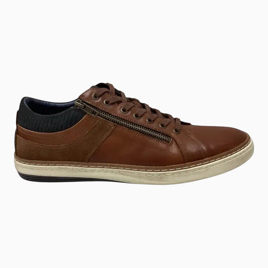 The Shoe Shop Whistle brown leather sneaker with side zip, padded collar, and off-white rubber outsole.