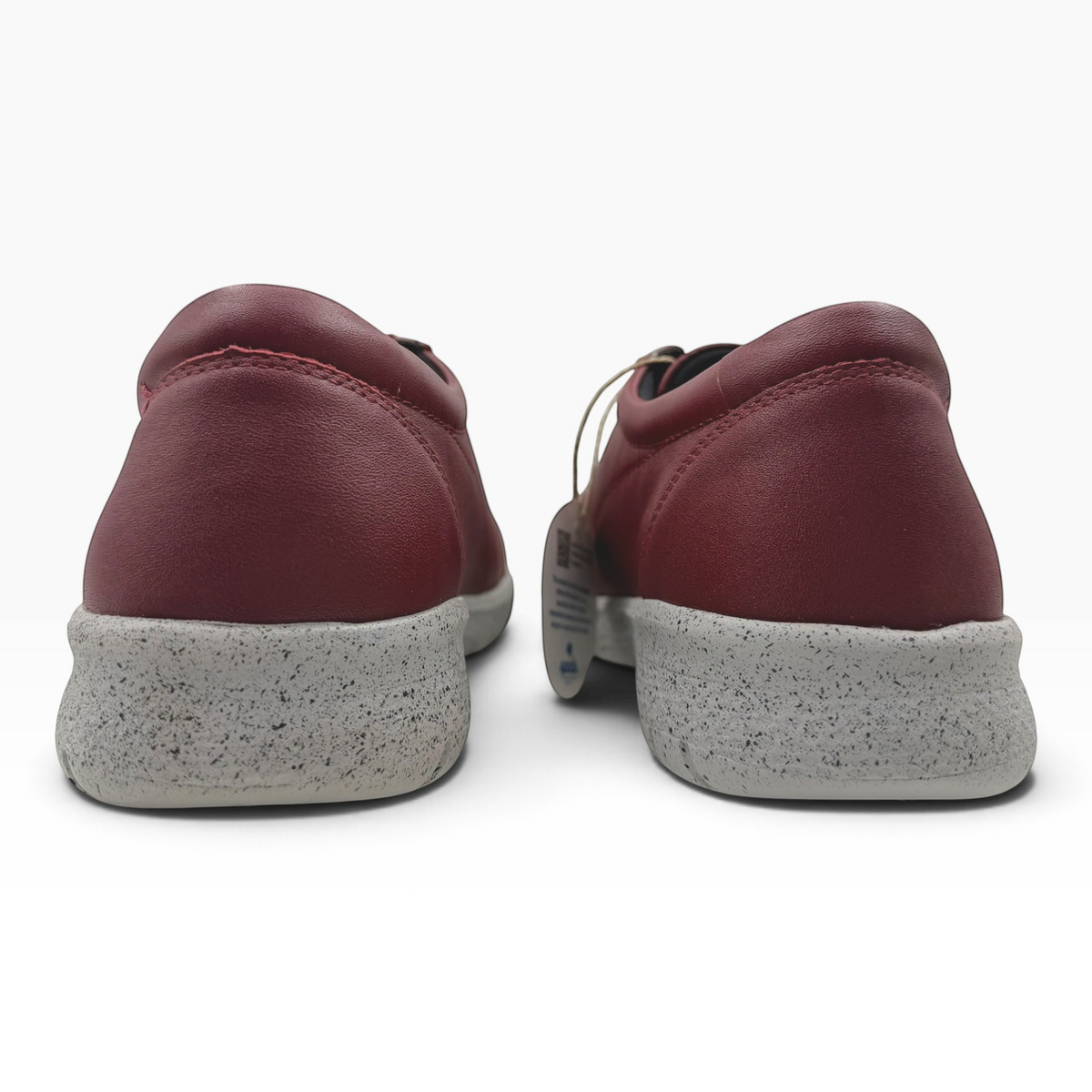 The Shoe Shop Solar XF burgundy leather sneakers showing the back view with a grey speckled slip-resistant sole.
