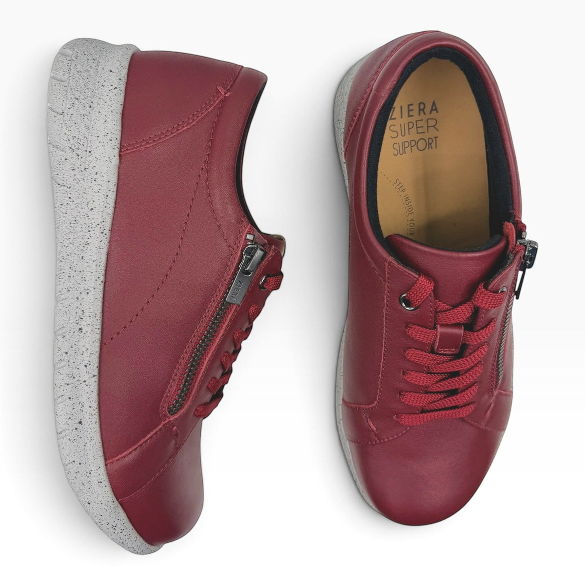 The Shoe Shop Ziera Solar XF burgundy leather sneakers with side zip, lace-up closure, and speckled grey sole.