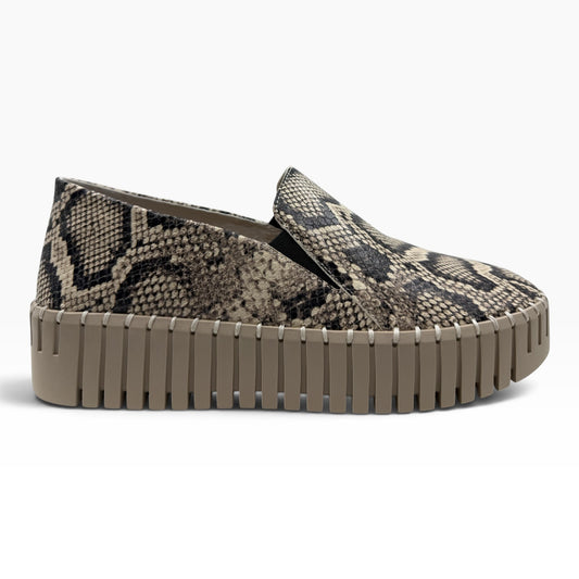 The Shoe Shop Byrona slip-on sneaker featuring a grey and black snakeskin print upper and a thick beige platform sole.