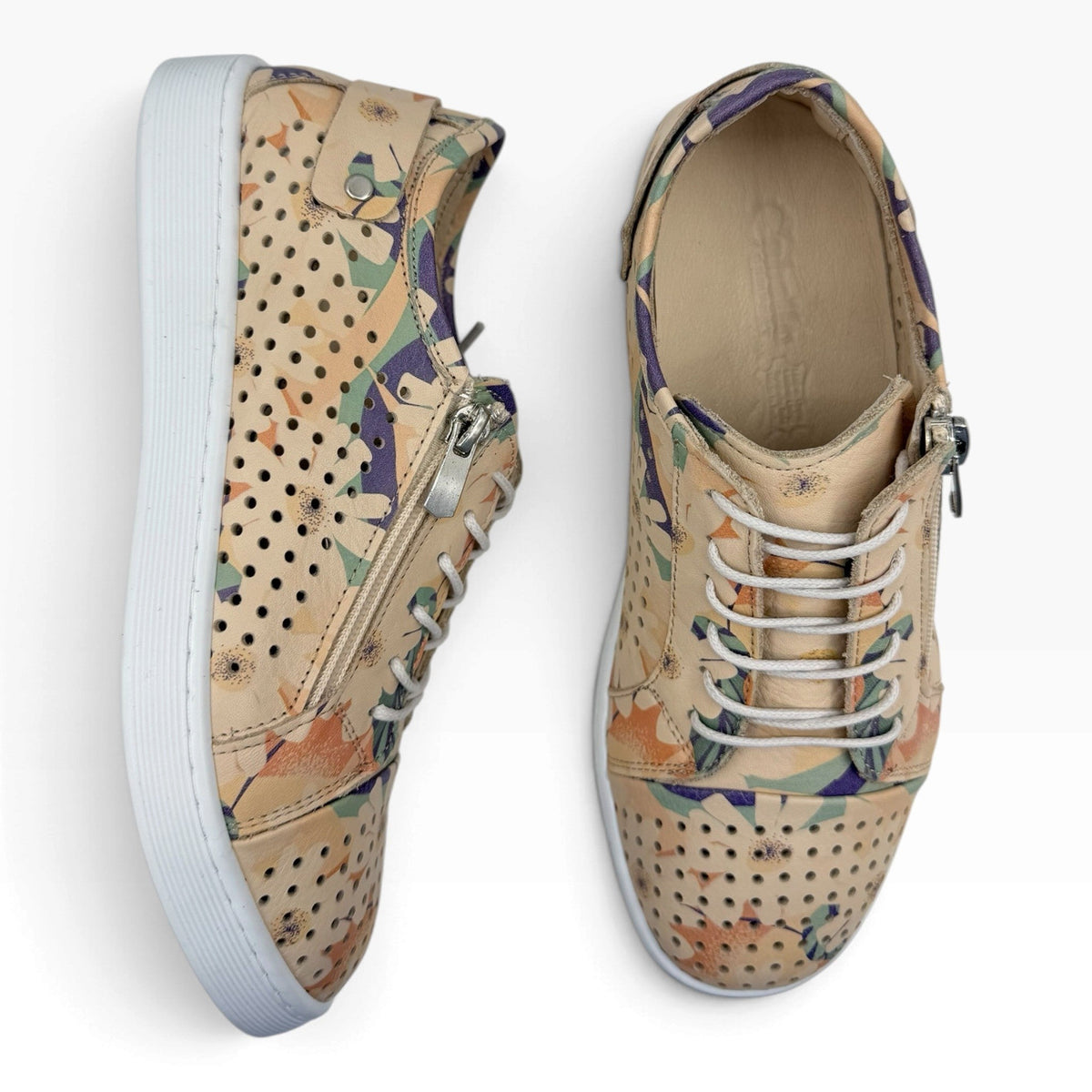 The Shoe Shop Cabello EG17 wide-fit leather sneakers featuring a beige floral print, side zip, and white rubber sole.