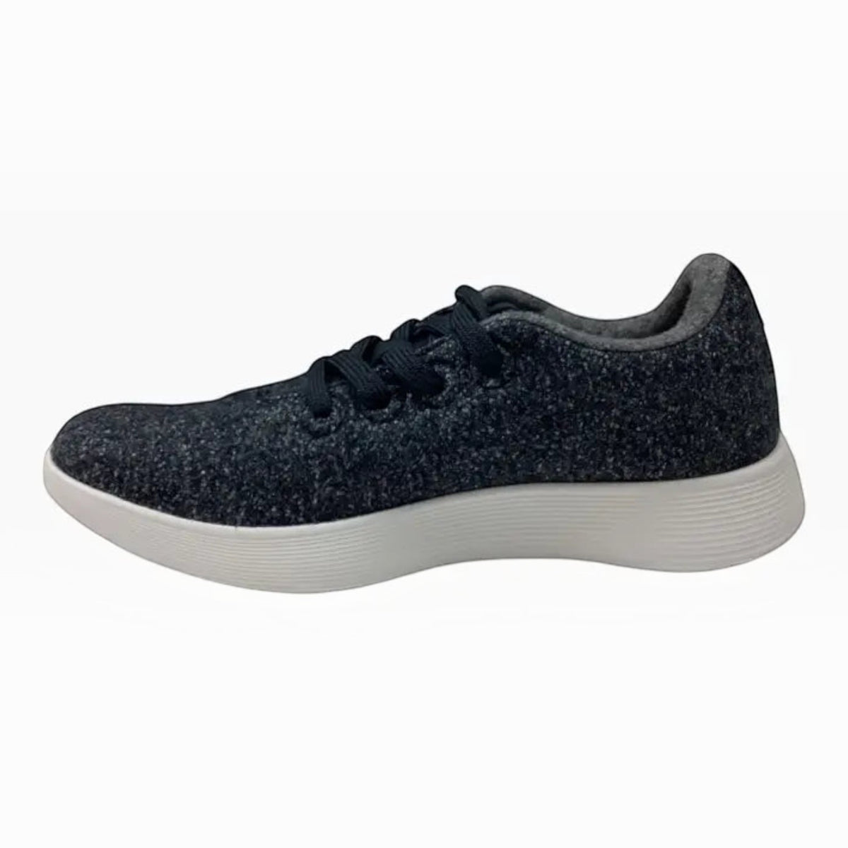 The Shoe Shop Wool Runner sneaker in charcoal grey Merino wool with a white cushioned sole and lace-up design.