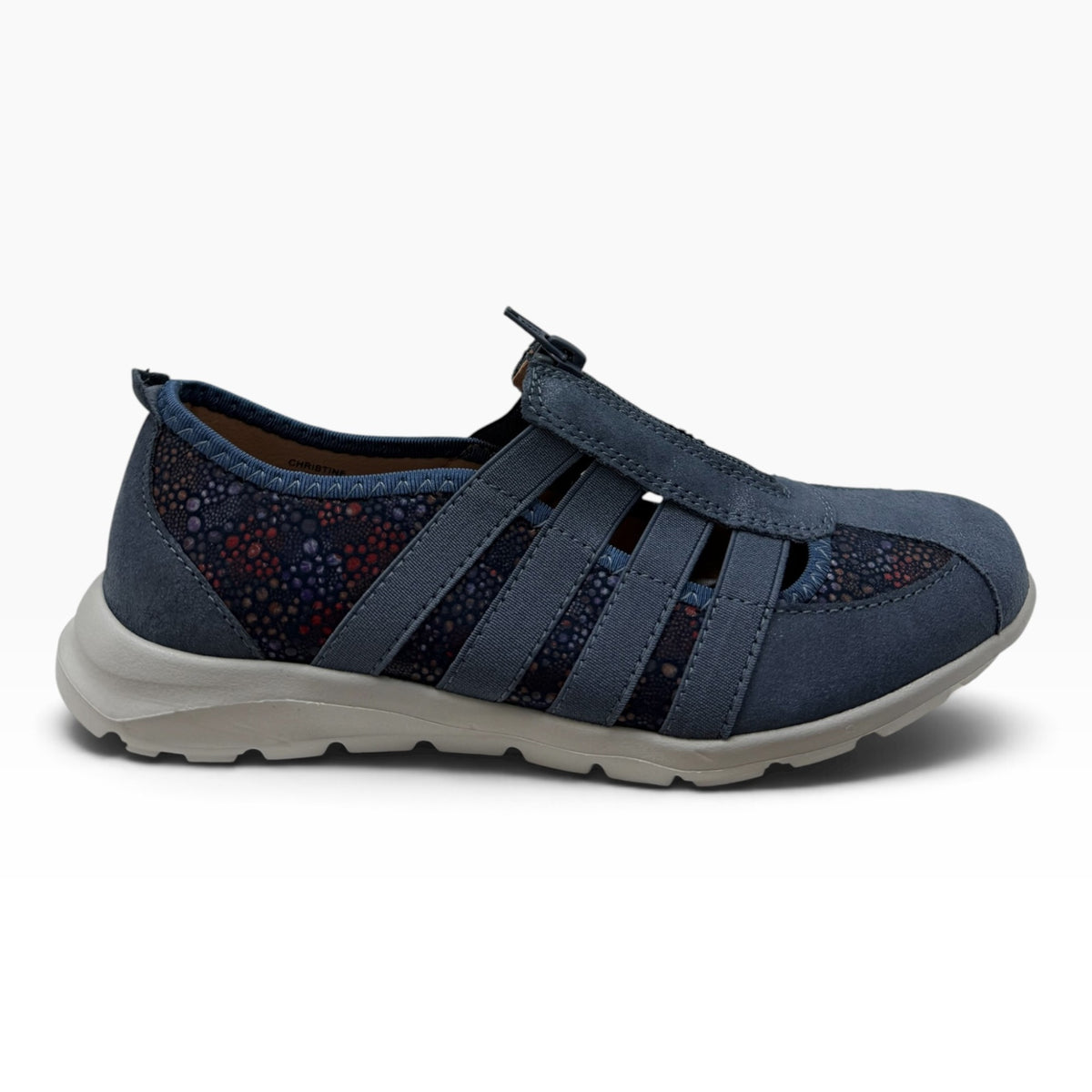 The Shoe Shop Christine navy leather slip-on shoe with patterned side panels, central zipper, and rubber sole.