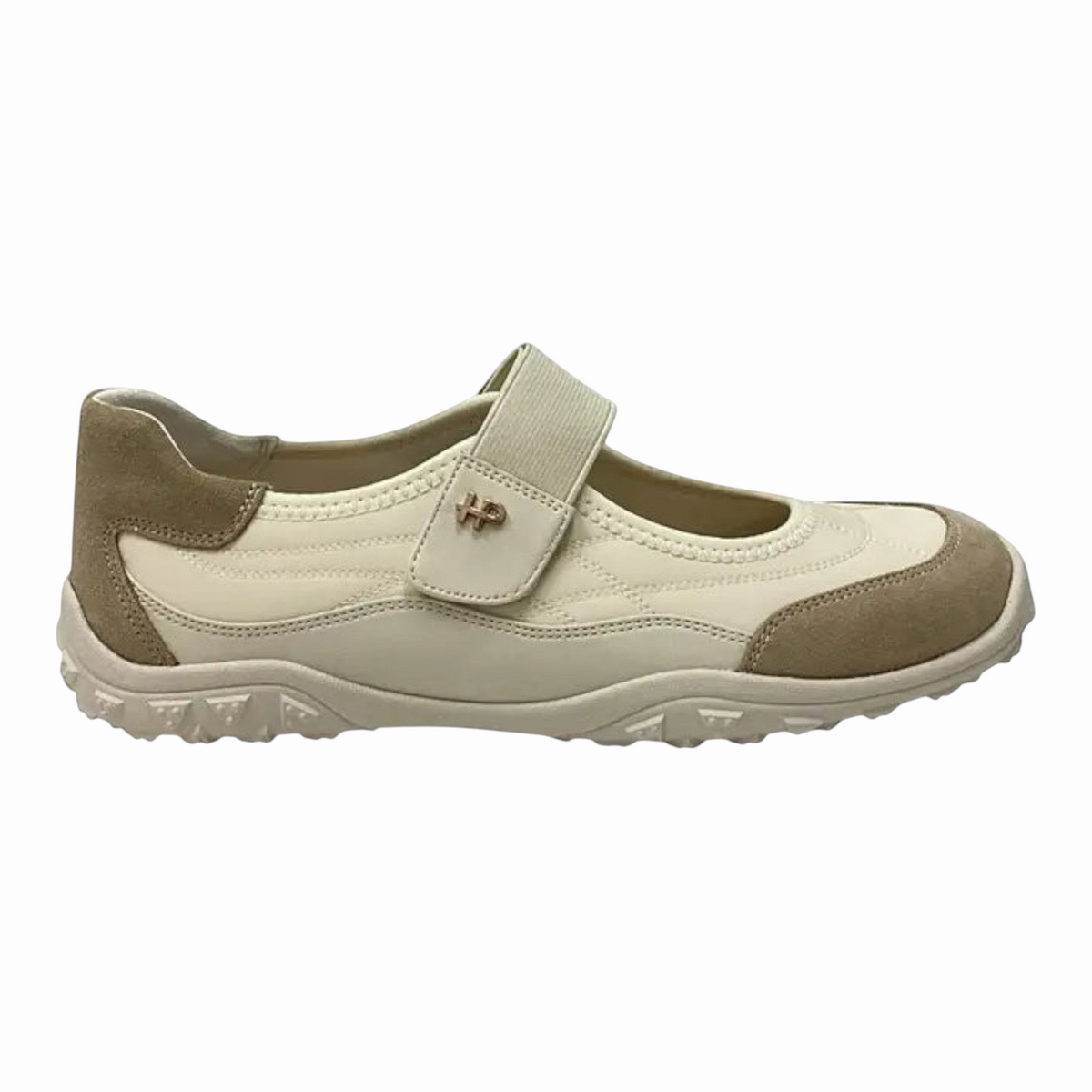 The Shoe Shop Hush Puppies Ciel sneaker in cream and beige with a self-fastening strap and durable rubber outsole.