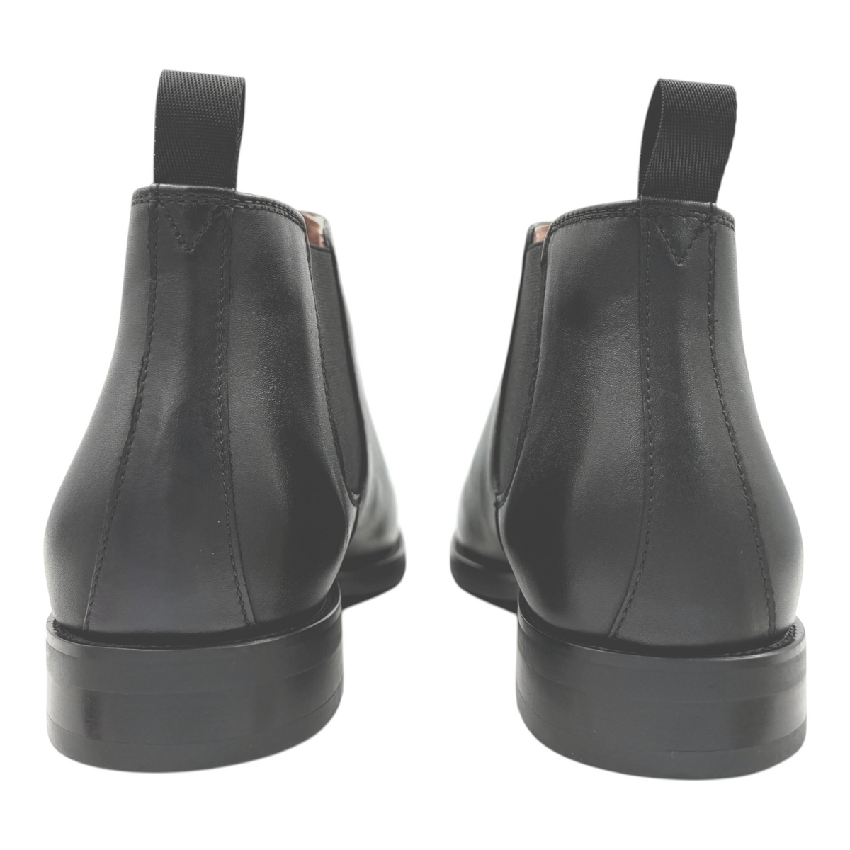 The Shoe Shop Coleman black leather Chelsea boots viewed from the back showing pull tabs and rubber soles