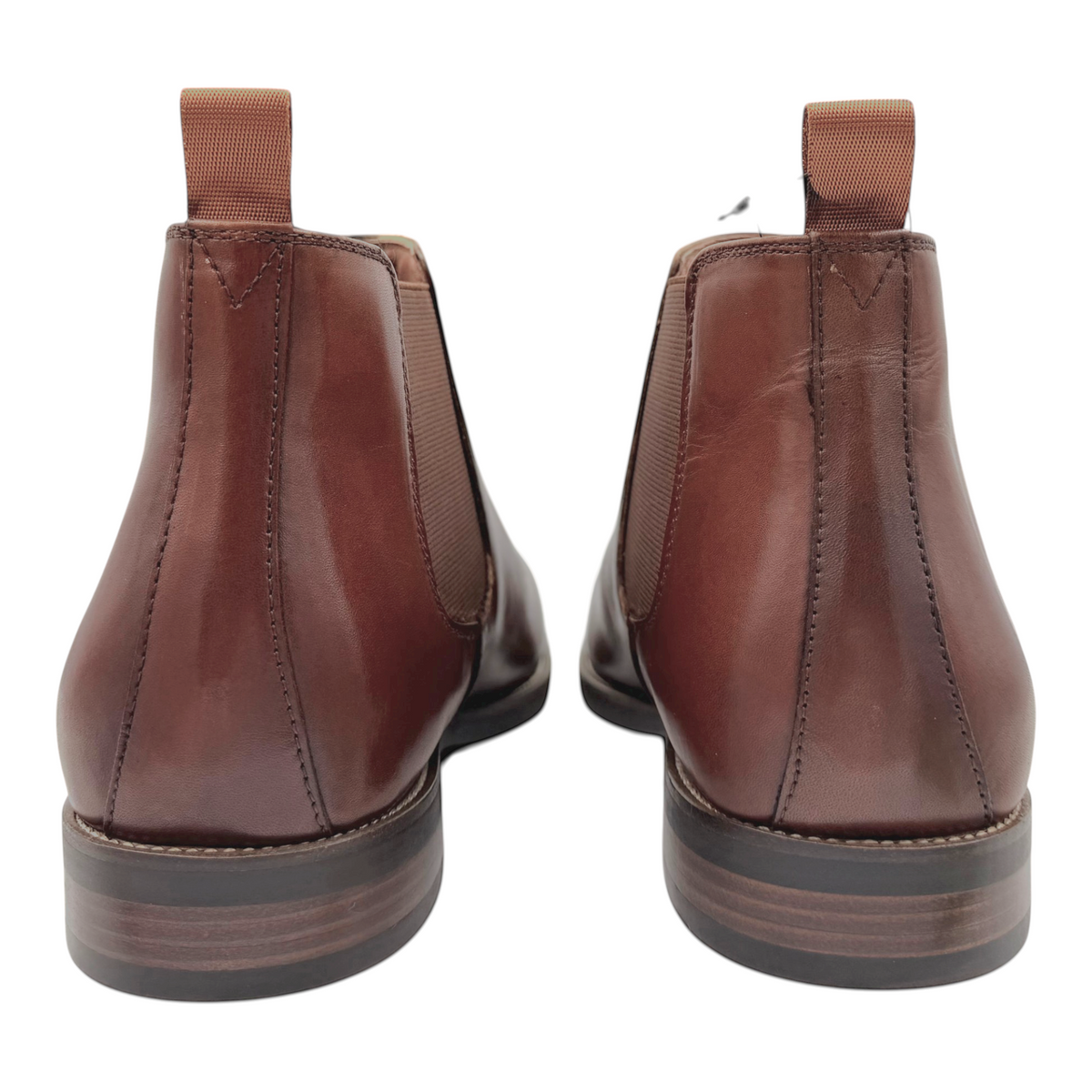 The Shoe Shop Coleman cognac full-grain leather Chelsea boots, back view showing pull tabs and rubber soles.
