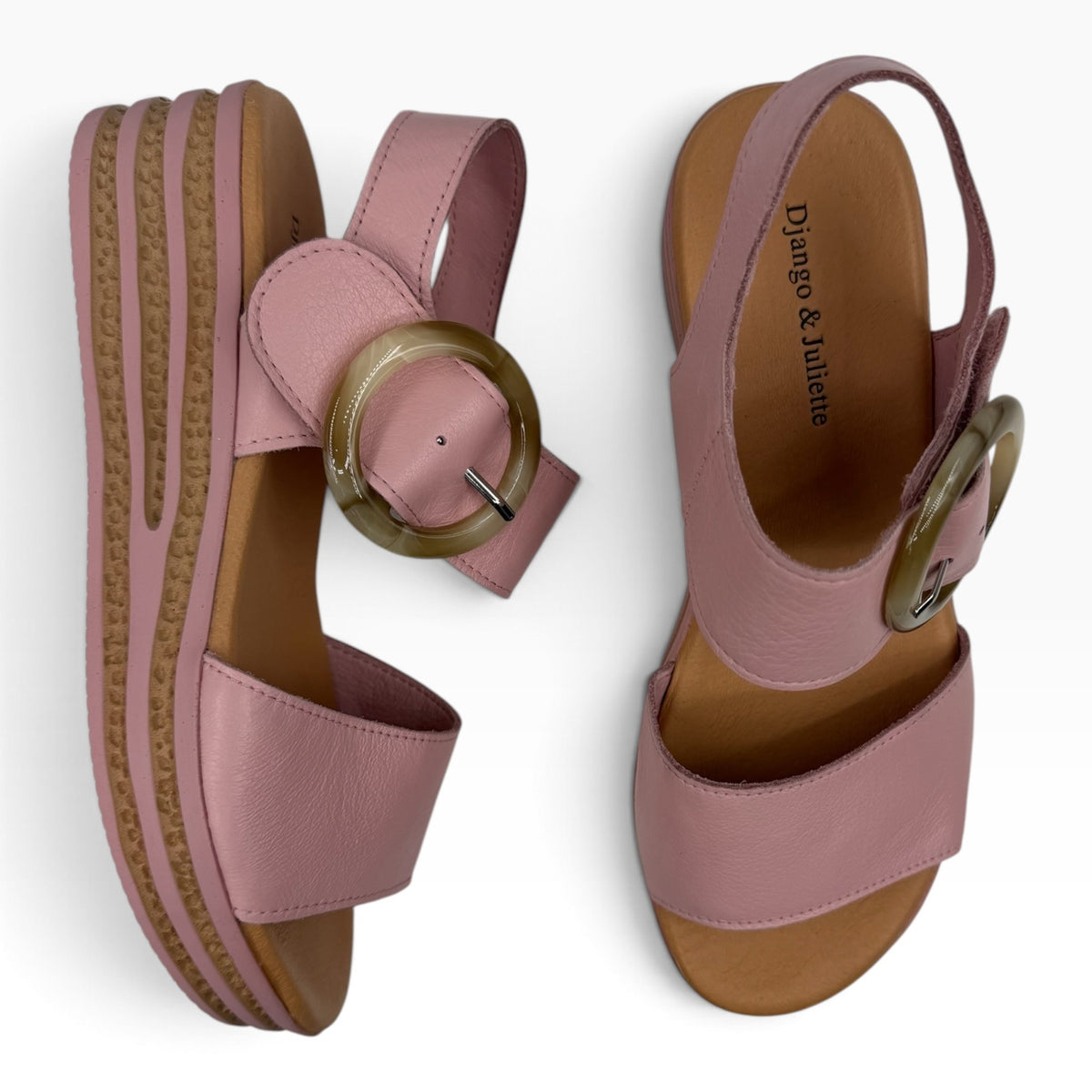 The Shoe Shop Cubbie pink leather wedge sandals with a large circular buckle and platform sole, top-down view.