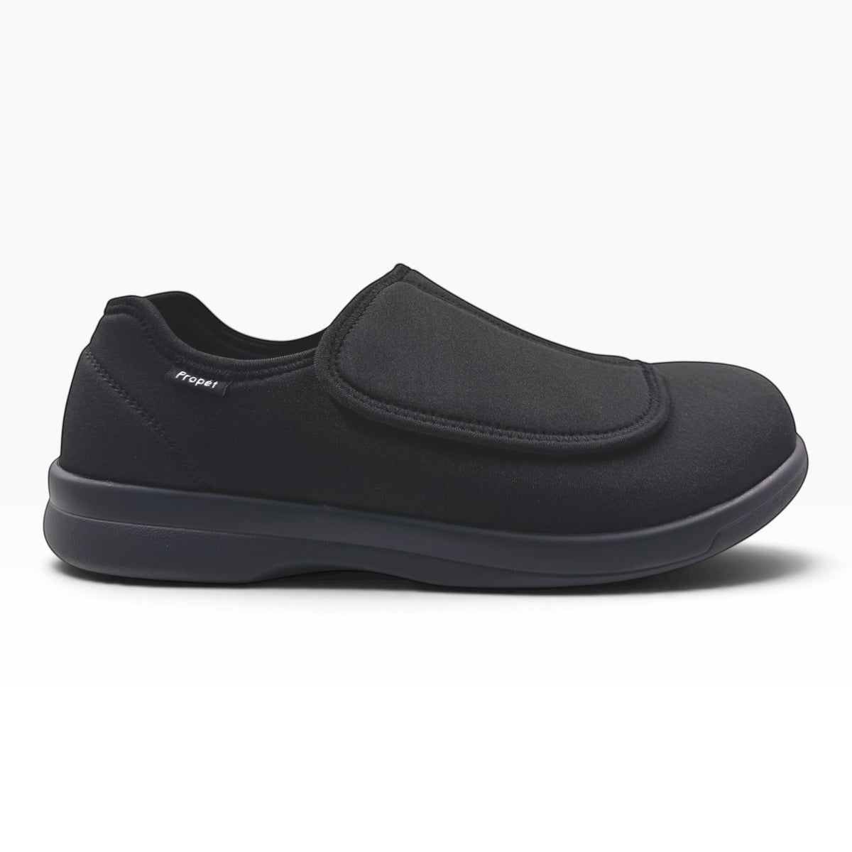 The Shoe Shop Cush n Foot black neoprene slipper with an adjustable hook-and-loop strap and durable PU outsole.
