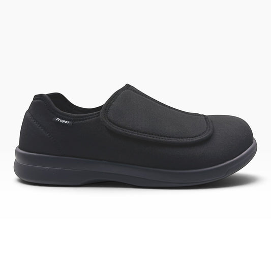 The Shoe Shop Cush n Foot black neoprene slipper with an adjustable hook-and-loop strap and durable PU outsole.