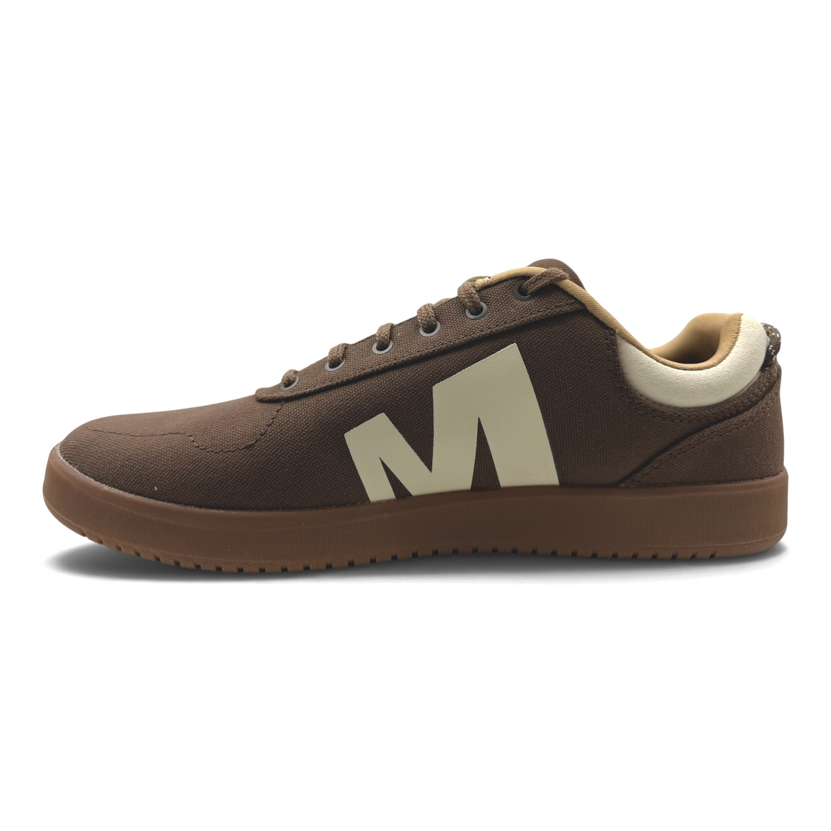 The Shoe Shop Cygnet Canvas mens sneaker in earthen brown with a large cream M logo and matching brown rubber sole.