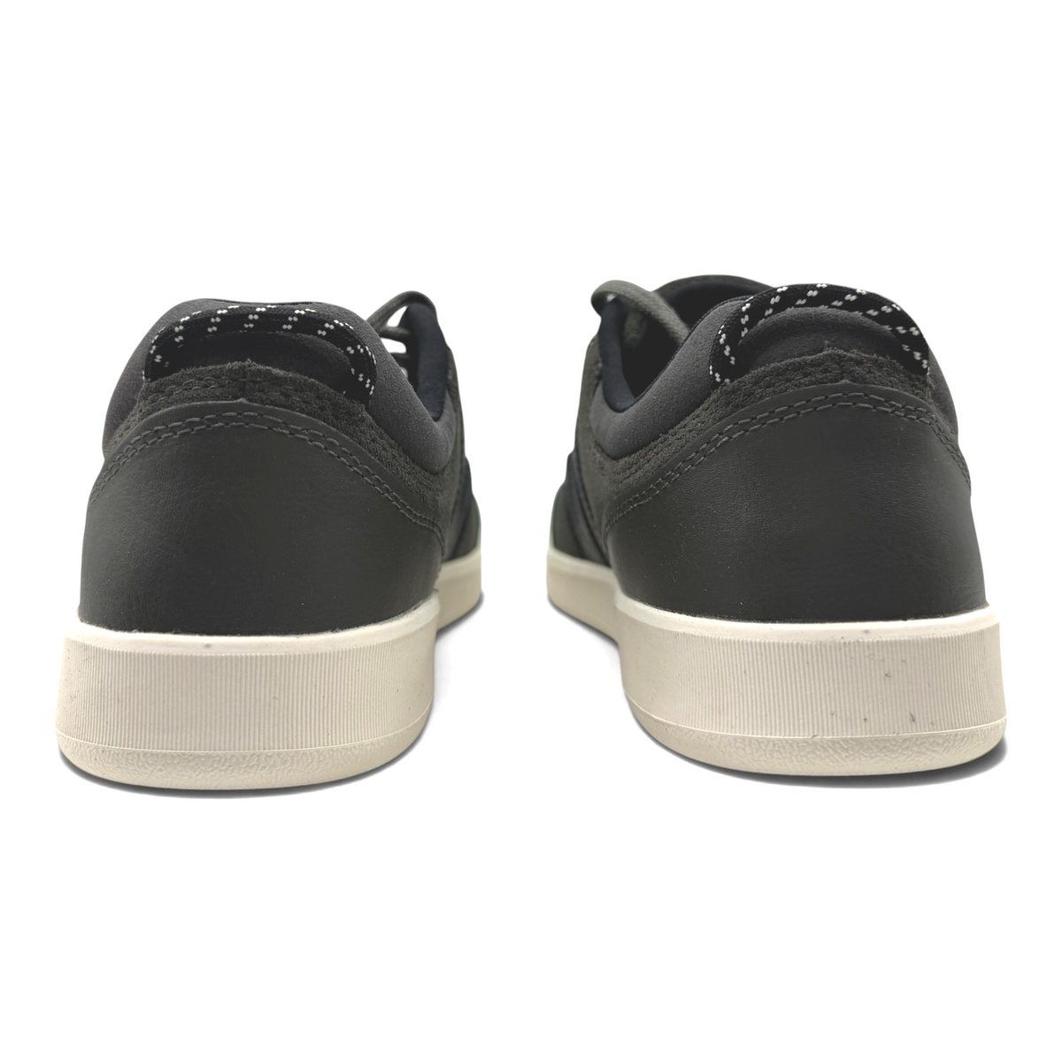 The Shoe Shop Cygnet leather sneakers in black with a contrasting beige rubber sole, rear view showing padded collar.