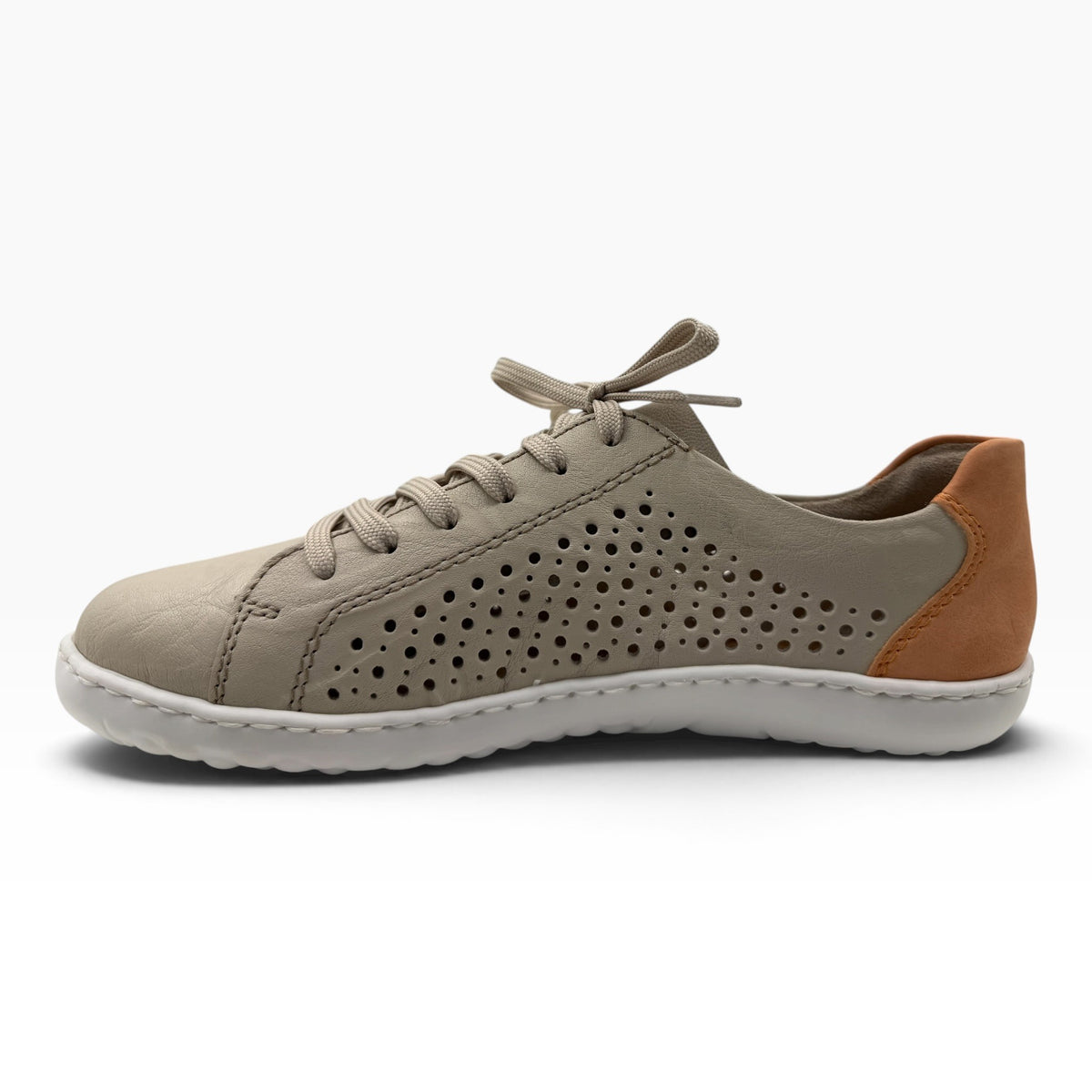 The Shoe Shop Dana sneaker in beige leather with laser-cut perforations, lace-up closure, and tan heel detail.
