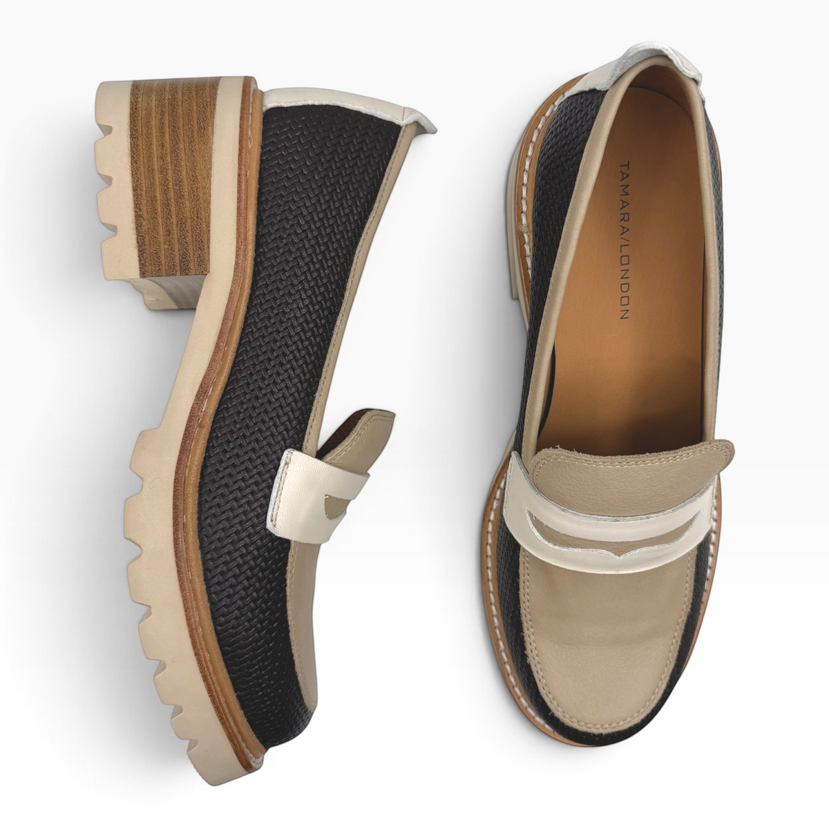 The Shoe Shop Delmira loafer featuring a black textured upper, beige contrast panels, and a chunky block heel.