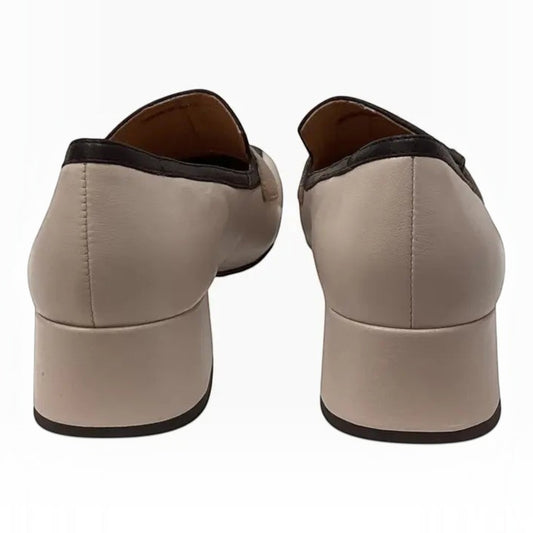 The Shoe Shop Denial leather loafers in beige with a dark brown trim and a comfortable block heel, rear view.