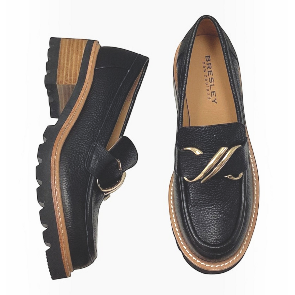 The Shoe Shop Dylan black leather loafer with front zip, gold-tone buckle, and low block heel