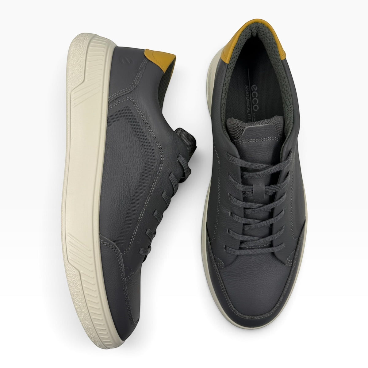 The Shoe Shop Ecco Move low-profile sneakers in dark grey leather with a mustard yellow heel tab and cream sole