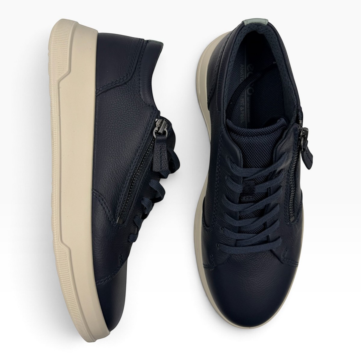 The Shoe Shop Ecco Move navy leather sneakers with lace-up closure and side zip detail on a cream sole