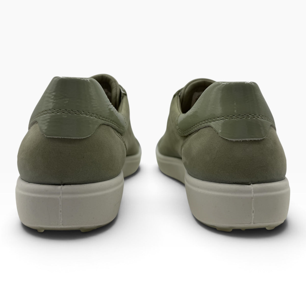 Back view of The Shoe Shop Ecco Soft 7 sneakers in tea green suede with a glossy heel detail and beige rubber sole.