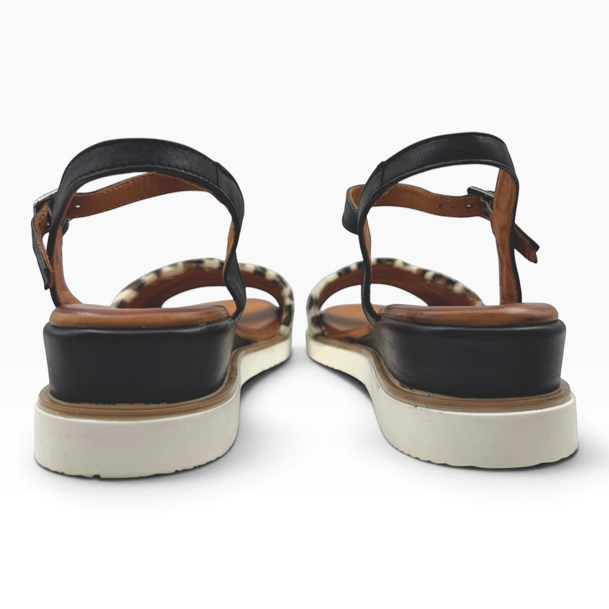 The Shoe Shop Eclipse sandals featuring leopard-print leather, black straps, and a supportive 5cm wedge heel.