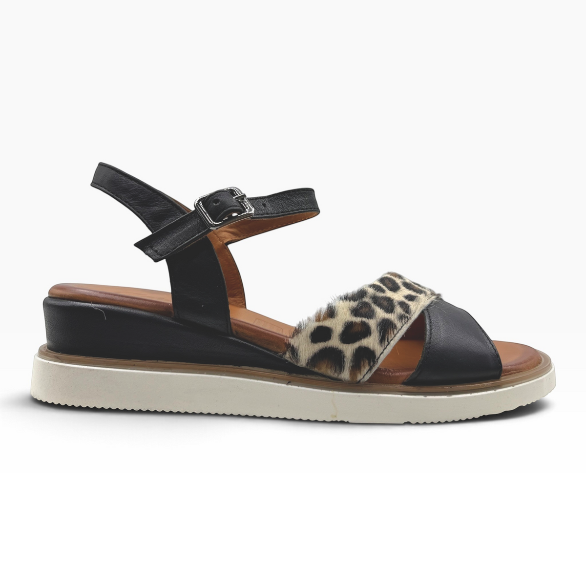 The Shoe Shop Eclipse sandal featuring black leather, leopard-print detail, and a supportive 5cm wedge heel.