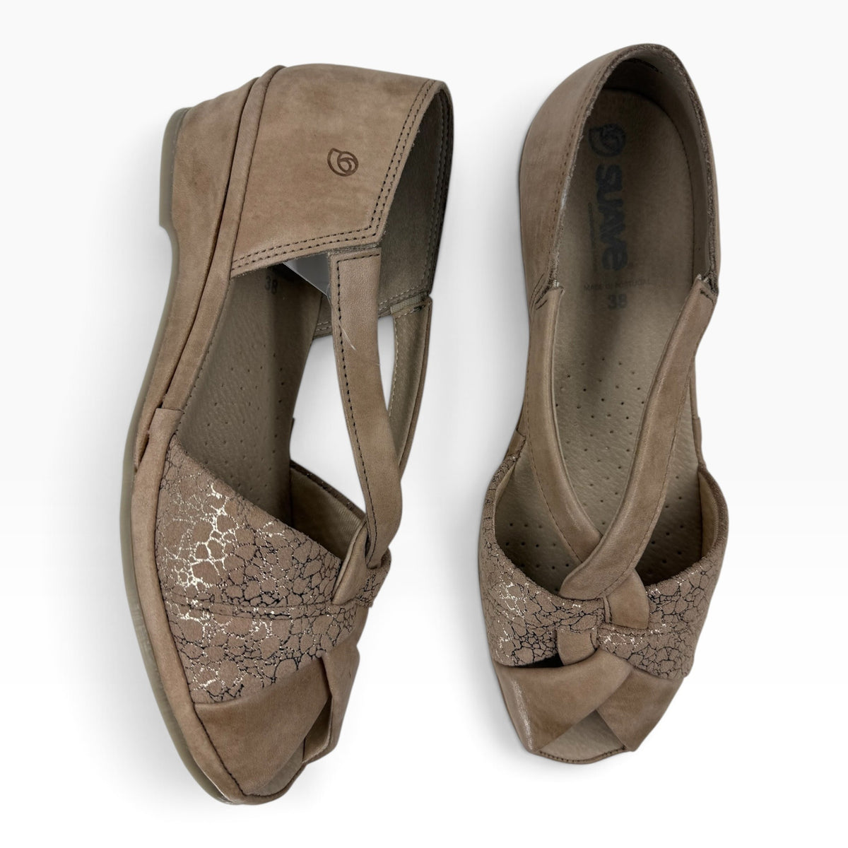 The Shoe Shop Emerald flat sandals in taupe suede with crossed straps, textured metallic detailing, and a low wedge.