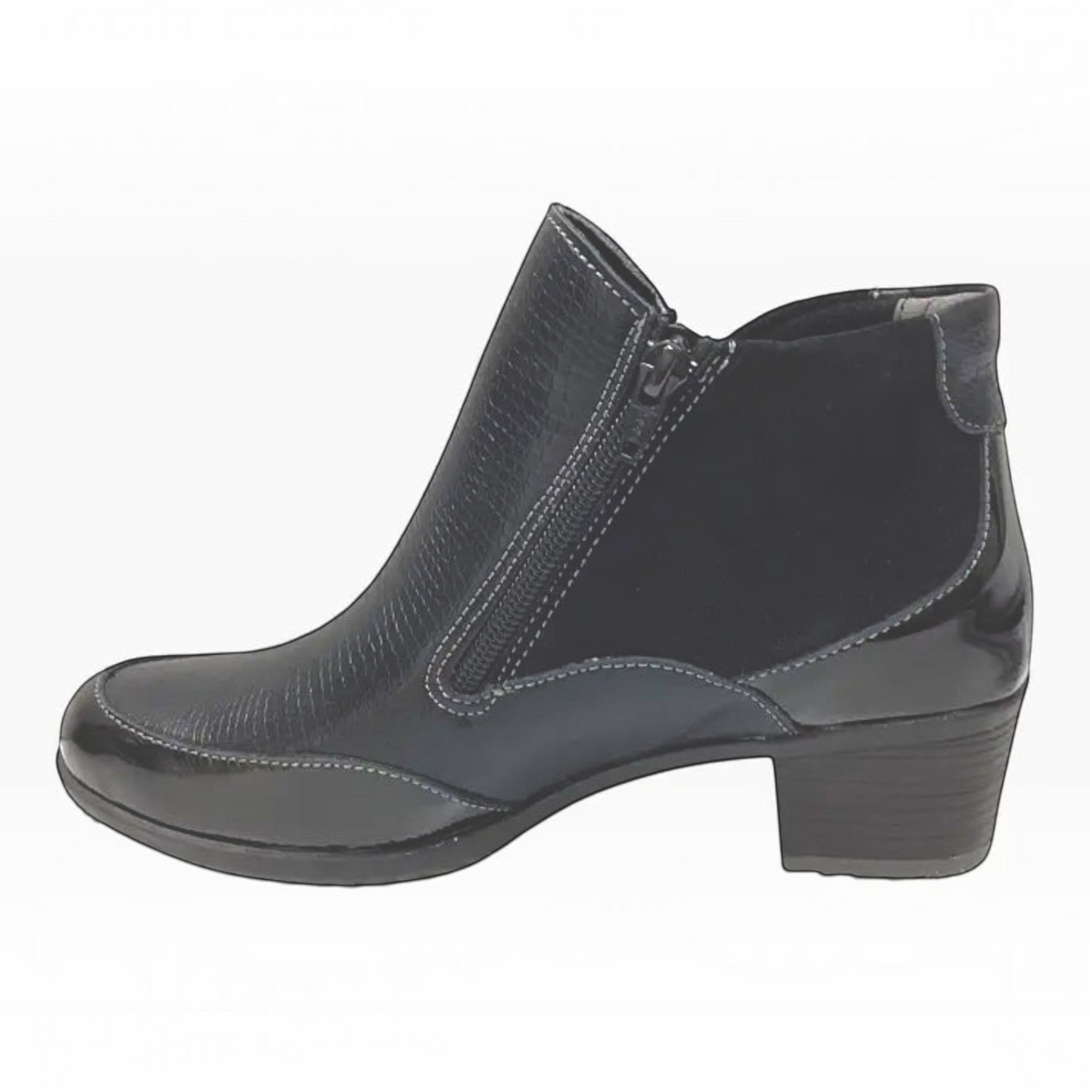 The Shoe Shop Emmi black ankle boot featuring a mix of smooth leather, suede, and patent detailing with a block heel.