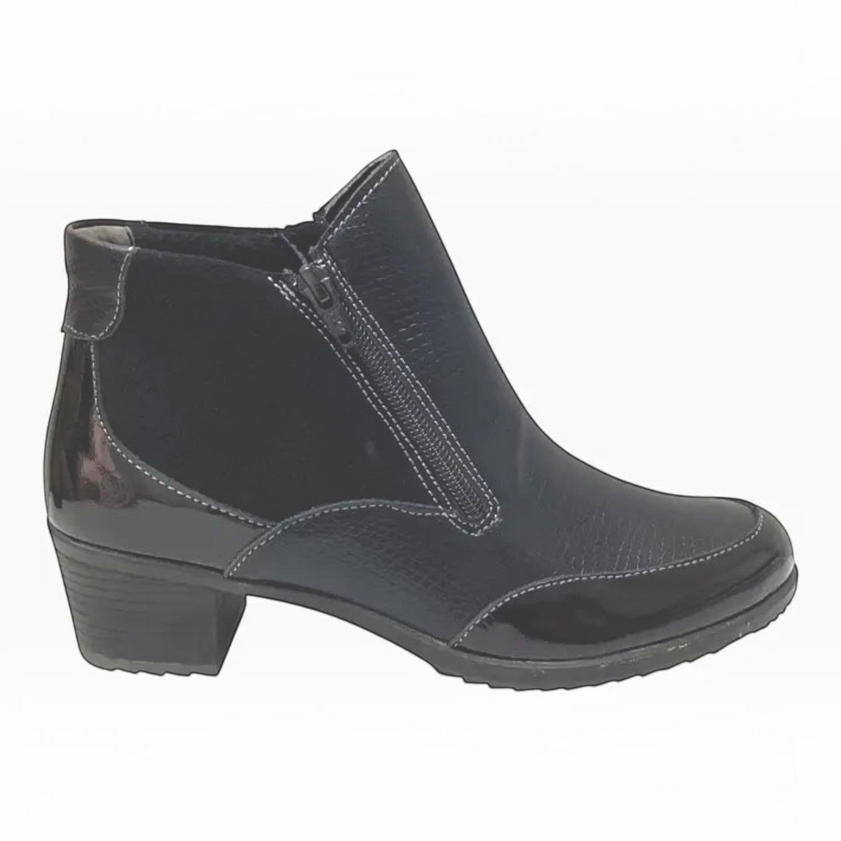 The Shoe Shop Emmi black ankle boot featuring a mix of smooth leather, suede, and patent detailing with a block heel.