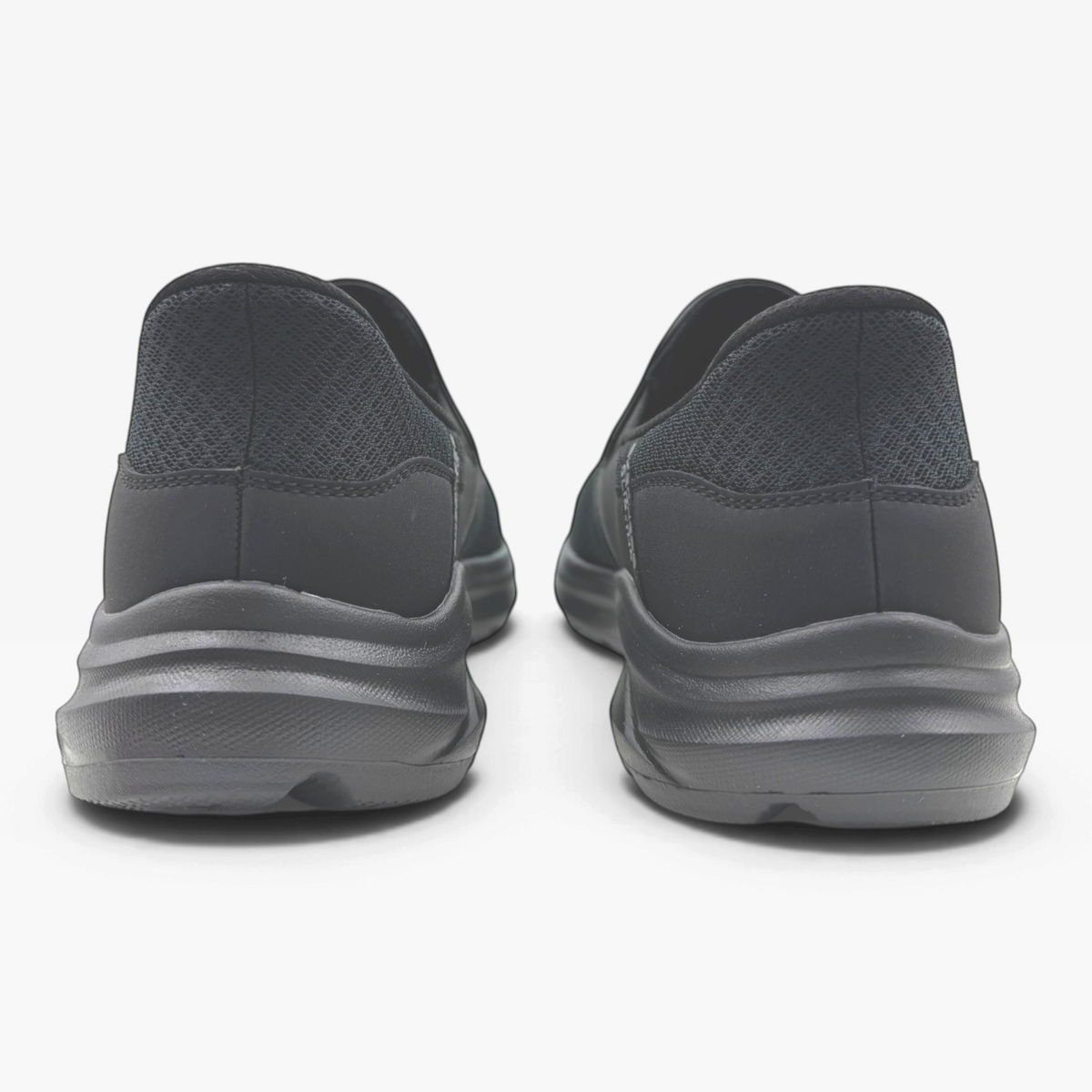 The Shoe Shop Equalizer Stoaver regular fit black slip-on shoes viewed from the back showing textured mesh heels