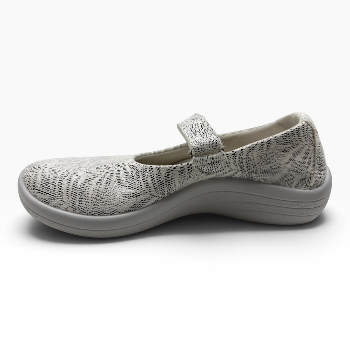 The Shoe Shop Estrela Mary-Jane flat in white with a black palm tree print, featuring an adjustable instep strap.