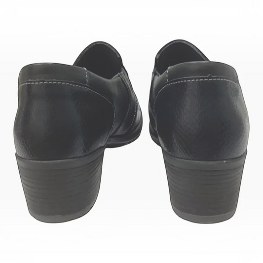 The Shoe Shop Etta black leather block heel shoes viewed from the back showing textured panels and rubber outsoles.