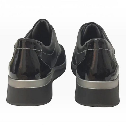 The Shoe Shop Ezra black leather shoes with patent detailing and a supportive low wedge heel, rear view