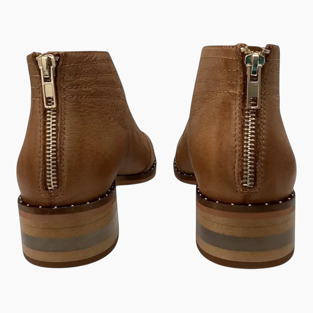 The Shoe Shop Faradays tan leather ankle boots featuring a back zipper closure and a stacked striped block heel