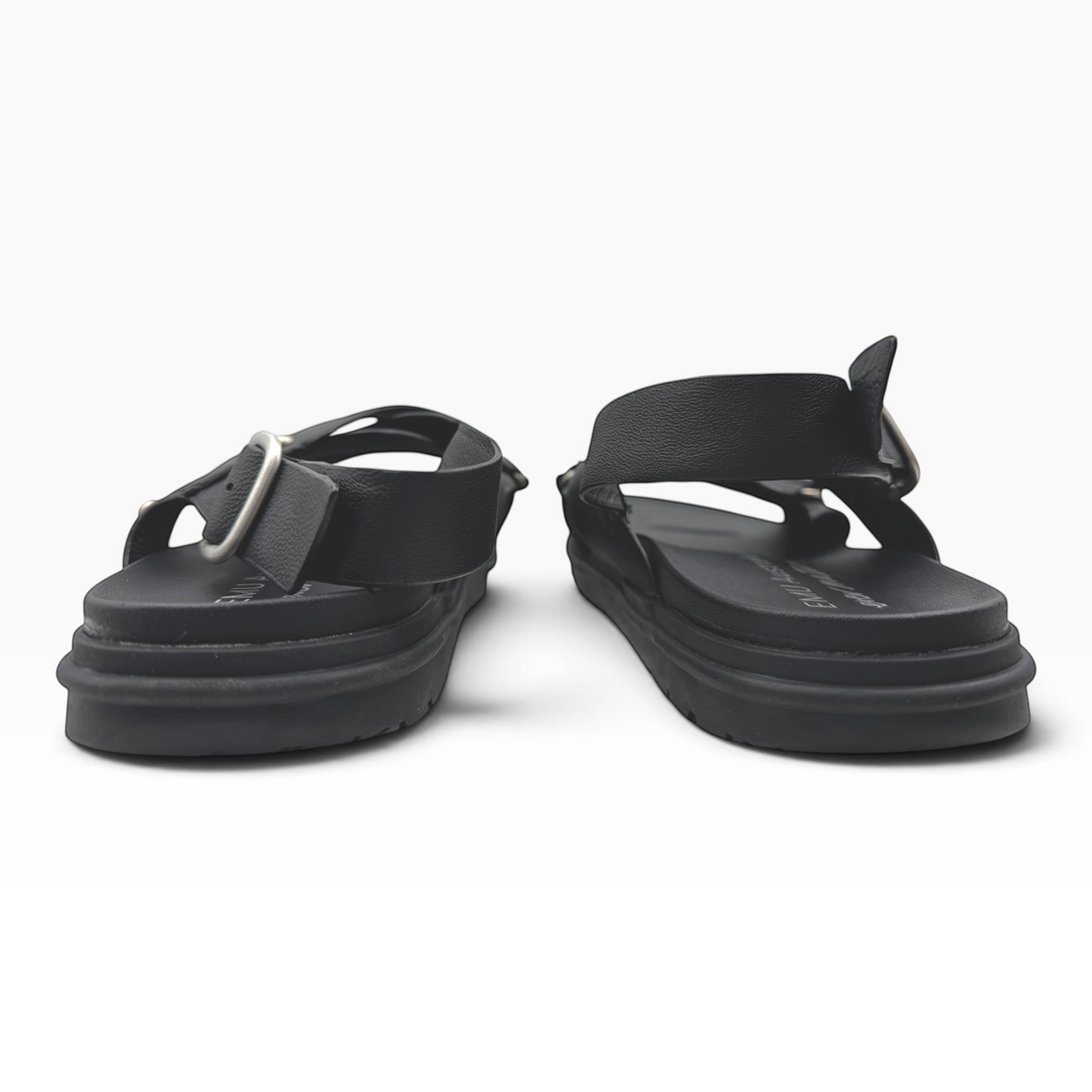 The Shoe Shop Faye espresso leather sandals with crossed front straps and adjustable buckle heel on a rubber sole.