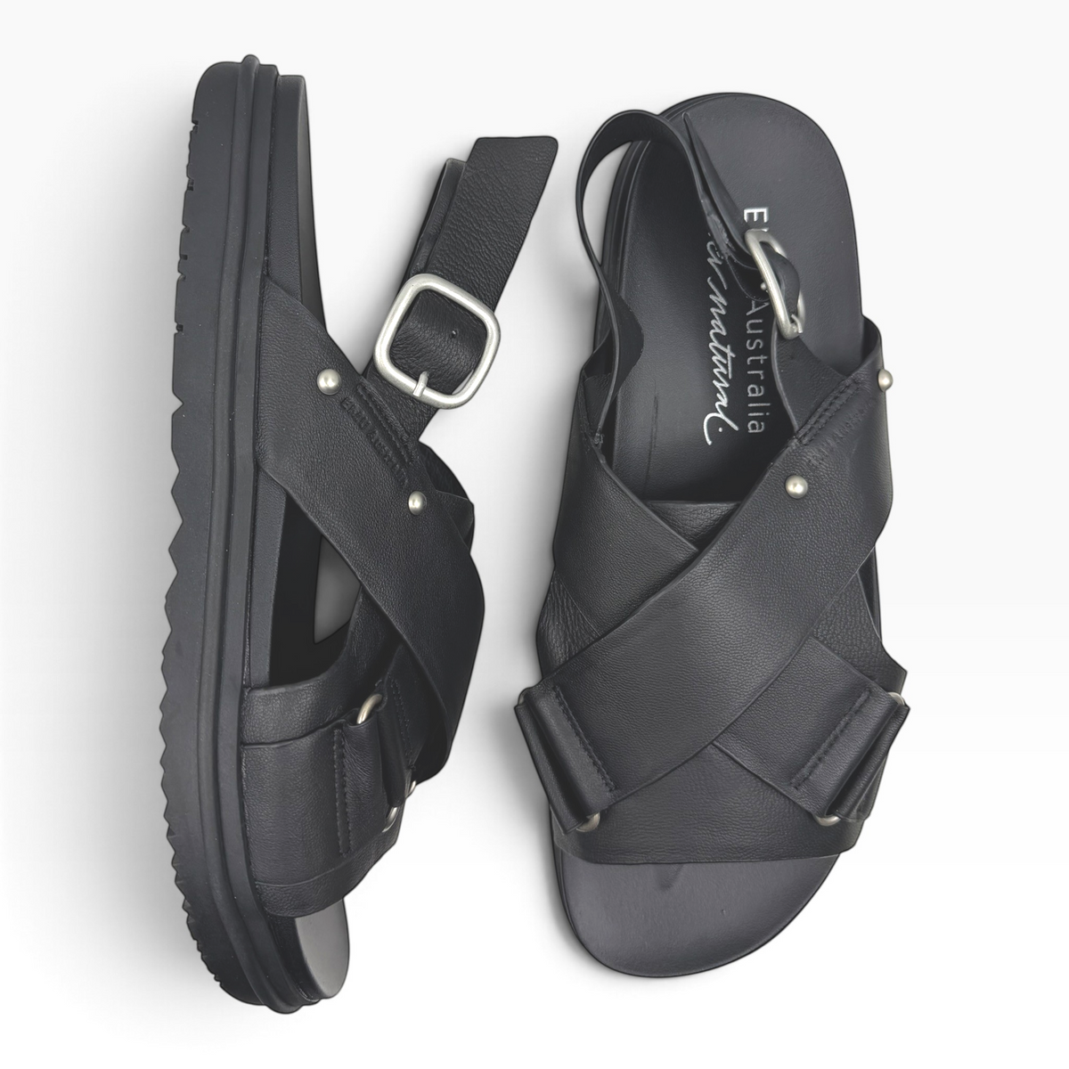 The Shoe Shop Faye espresso leather sandals with crossed straps, adjustable heel buckle, and ridged rubber sole.